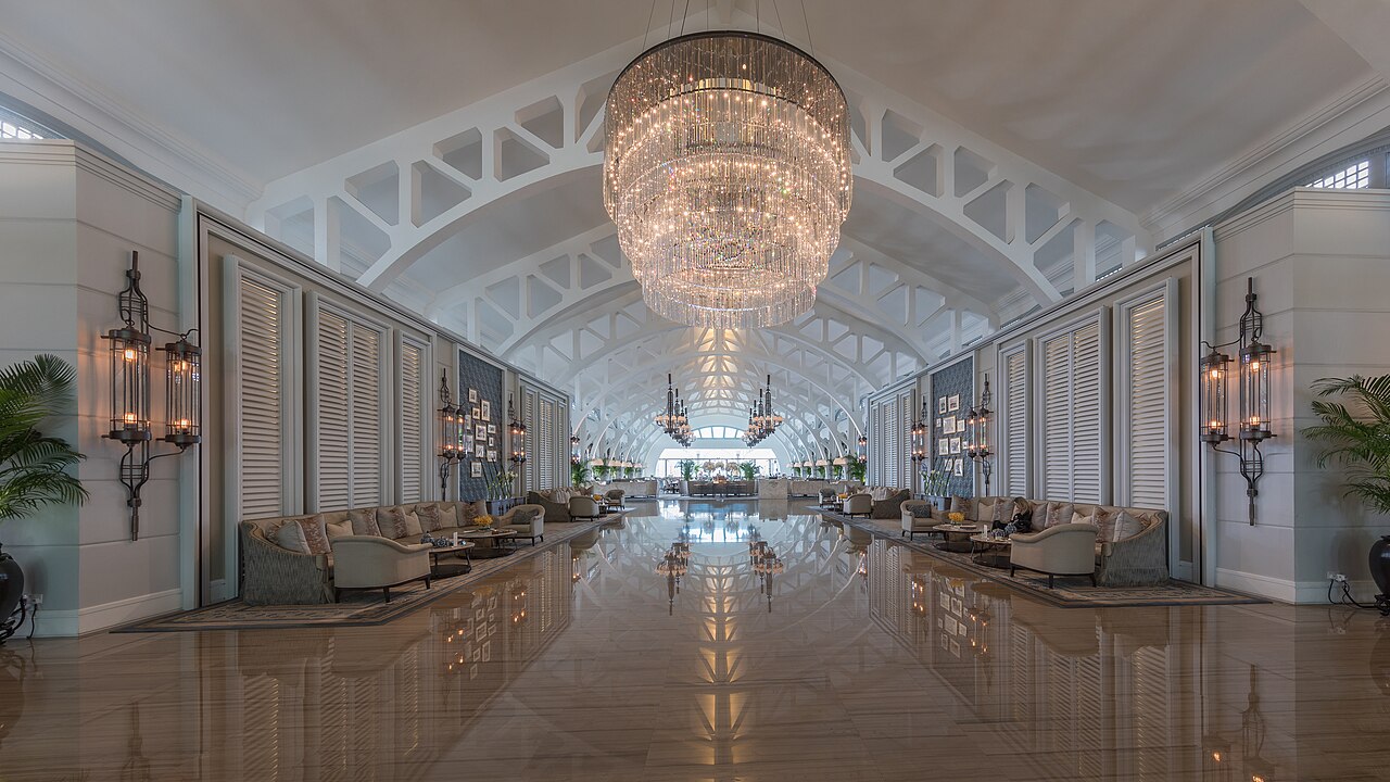 Lobby hall with couches and chandelier at The Fullerton Bay Hotel Singapore